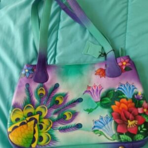 This Is .an All Leather Hsndpainted Purse Cested By  Sukriti And With Tags